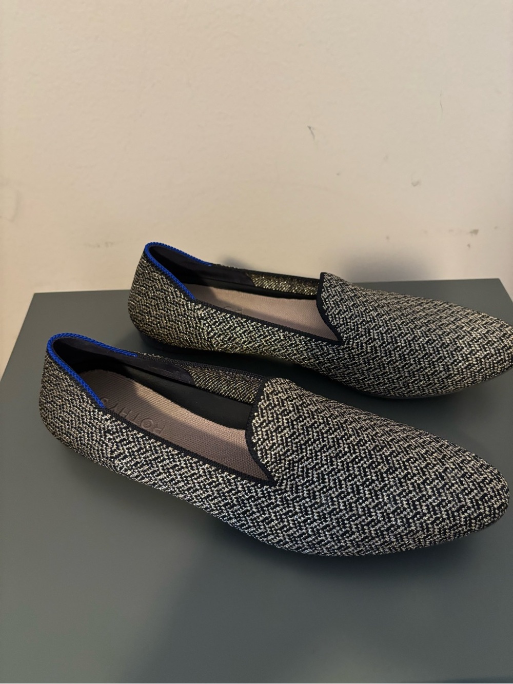 Rothys black and gold metallic slip on loafers.